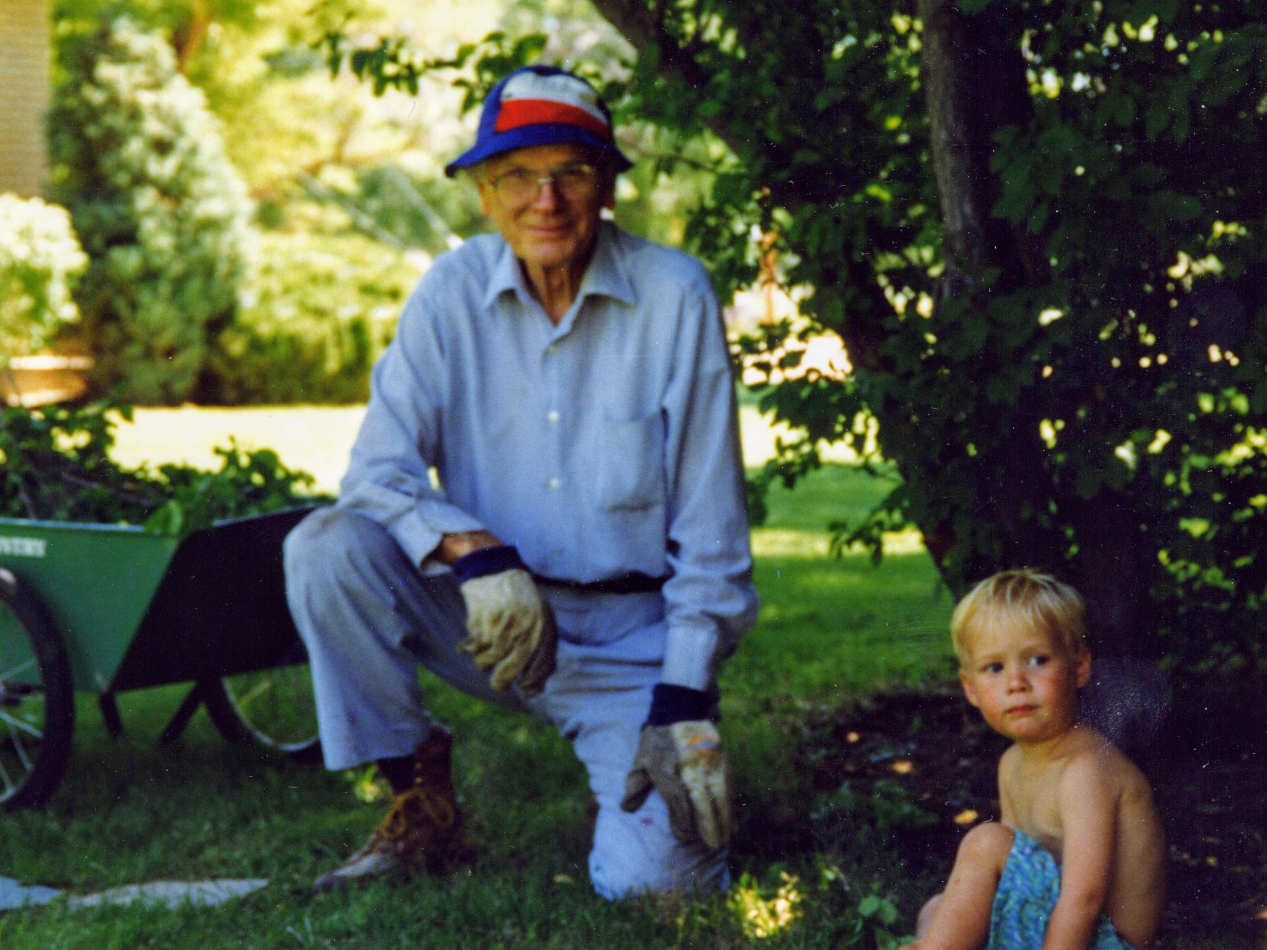 Loftis Sheffield gardening in Oakley, Idaho with grandson